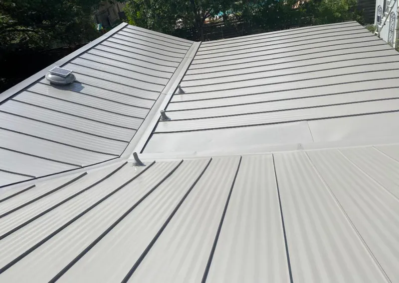 Solar attic fan installed on a metal roof for Roof Ventilation in Ogden